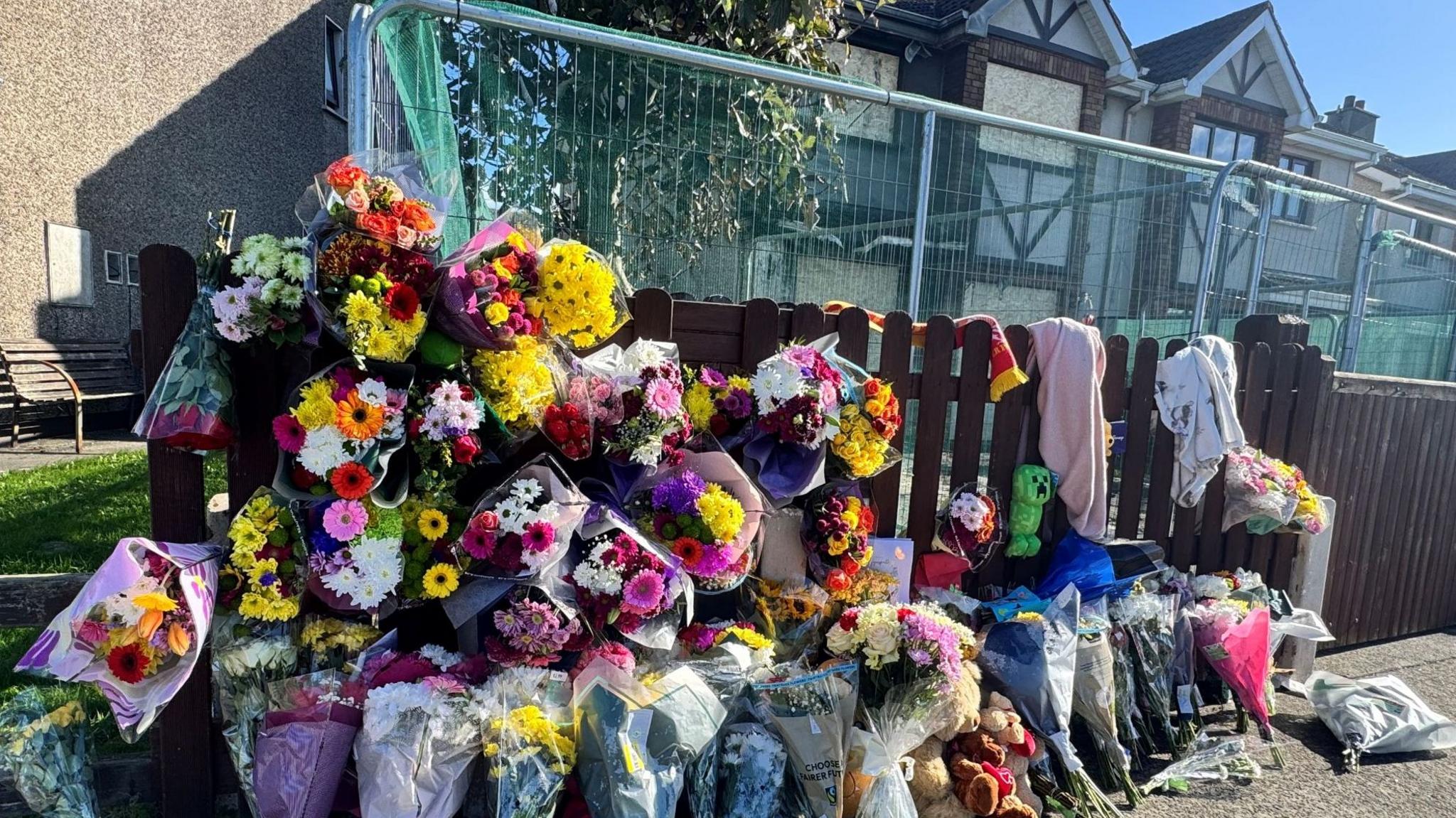 Flowers left at burned home