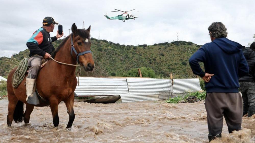 Helicopters rescue families after Mapocho river floods in Chile