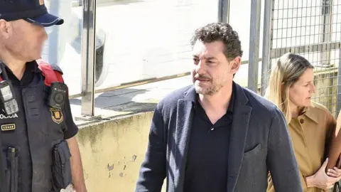 Mango Founder's Cliff Fall: Accident or Murder? Son Arrested in Spain Amid Family, Business Tensions