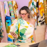Discover how a leading fabric designer's rise to fame became embroiled in controversy, leaving customers and suppliers in a web of unfulfilled orders and broken trust.