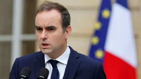 France Navigates Political Turmoil as Outgoing PM Seeks Stability to Avert Elections