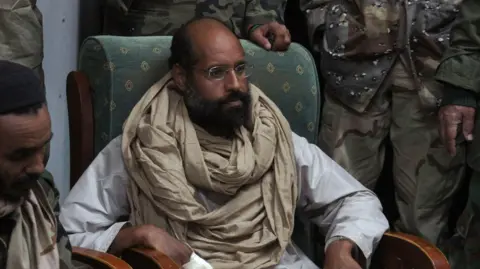 Saif al-Islam Gaddafi, Son of Former Libyan Leader, Reportedly Assassinated