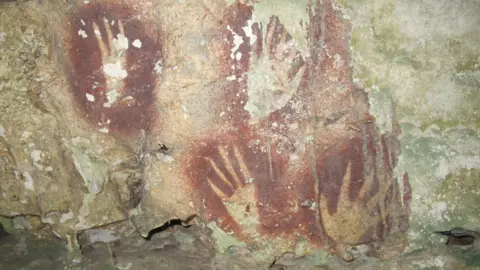Rediscovering Creativity: The Oldest Cave Painting of a Red Claw Hand
