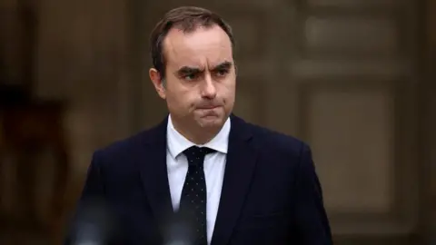 French Prime Minister Secures Essential Budget Bill Amid Political Turmoil