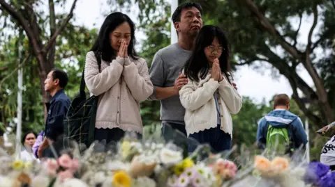 Tragedy in Hong Kong: Fire Death Toll Climbs to 146 as City Grieves