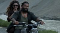 The release of the Bollywood spy film 'Dhurandhar,' featuring Ranveer Singh, has polarized audiences in India and Pakistan. The film, centered around an Indian spy in Karachi, mixes real geopolitical events with dramatized narratives, prompting debates about nationalistic undertones and historical portrayals. Critics and audiences are sharply divided, with some praising its ambitious storytelling while others decry its hyper-nationalist tone. Despite the controversy, 'Dhurandhar' has become a box-office success, reflecting the evolving dynamics of nationalist cinema in the region.